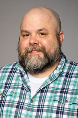 Headshot photo of Dustin Rogan