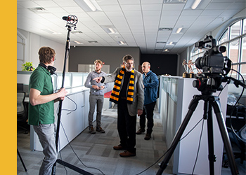 Photo videographers and videography equipment setup during an interview.